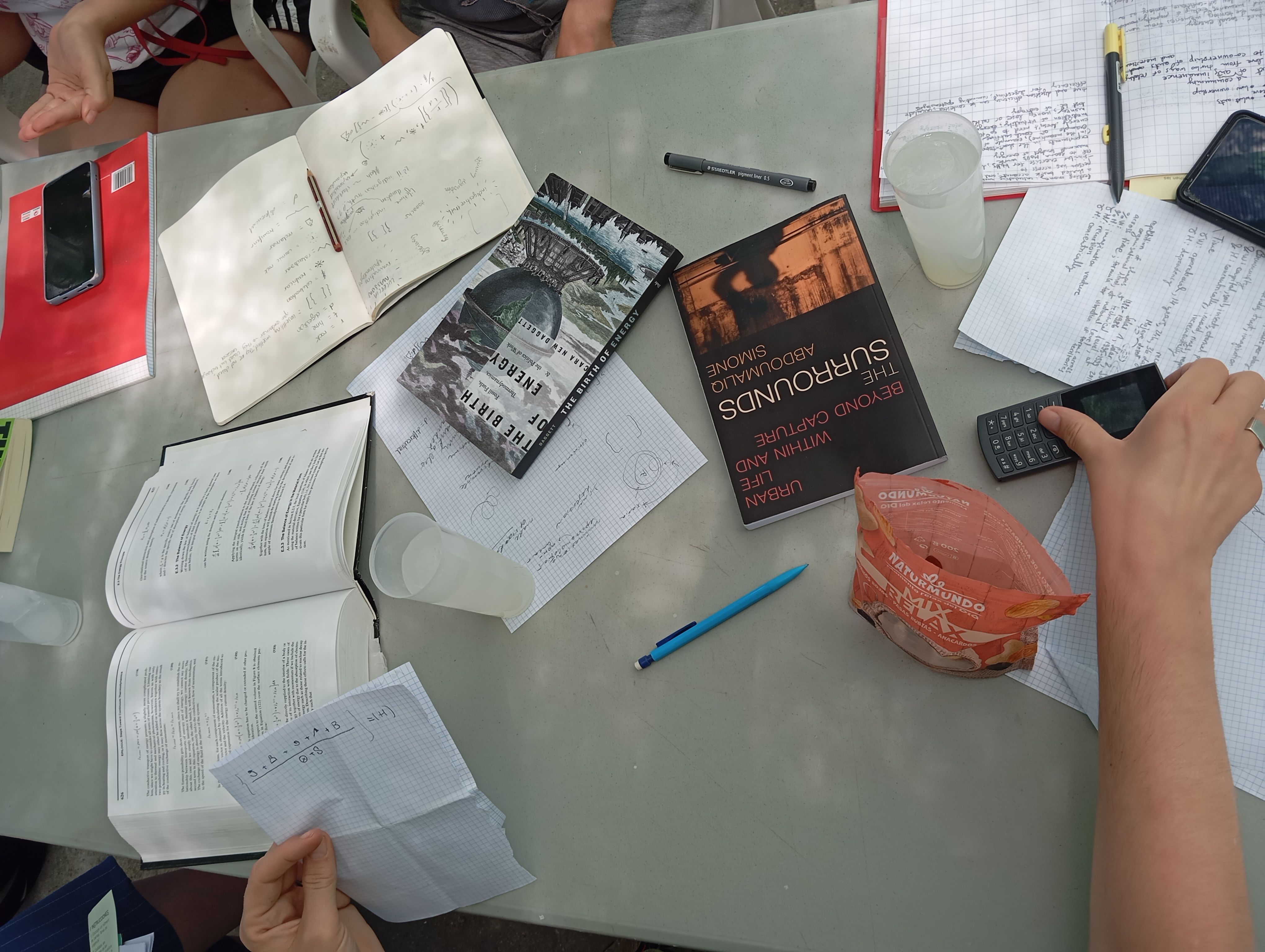 Extremadura, June 2025. A table filled with books, notebooks with formulas and a non-smartphone